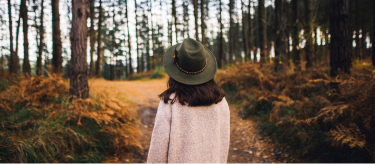 A person enjoying a walk in a forest